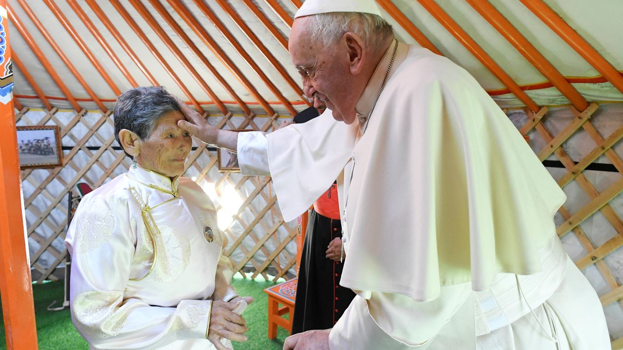 Pope Francis blesses Madame Tsetsege in the Mongolian capital. 