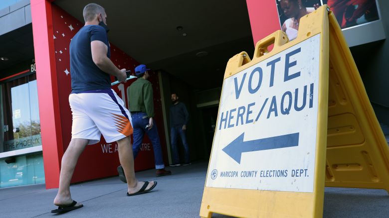 PHOENIX, ARIZONA - NOVEMBER 08: Voters arrive to cast their ballots at the Phoenix Art Museum on November 08, 2022 in Phoenix, Arizona. After months of candidates campaigning, Americans are voting in the midterm elections to decide close races across the nation. (Photo by Kevin Dietsch/Getty Images)