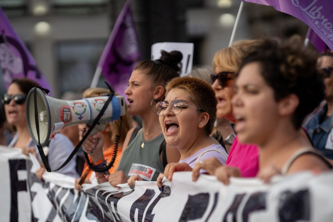 People are seen participating in a protest against Rubiales in Madrid, Spain, on Friday.