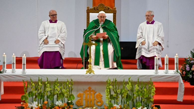 Pope Francis (C) reads the Homily during Holy Mass at the Steppe Arena in Ulaanbaatar on September 3, 2023. Pope Francis on September 3 hailed religion's power to resolve conflict and promote peace, on his final full day in the Mongolian capital of Ulaanbaatar for a visit that has seen him seek to build bridges with neighbouring China.