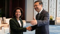 military special projects Shanghai Party Secretary Chen Jining (R) gestures as he shakes hands with US Commerce Secretary Gina Raimondo before a meeting in Shanghai on August 30, 2023.