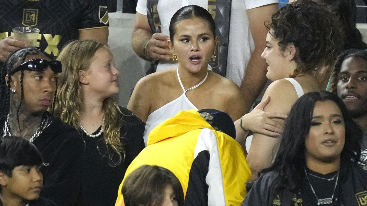 Entertainer Selena Gomez, center, is seen along with rapper Tyga, left, during the second half of a Major League Soccer match between Los Angeles FC and Inter Miami Sunday, Sept. 3, 2023, in Los Angeles. (AP Photo/Mark J. Terrill)