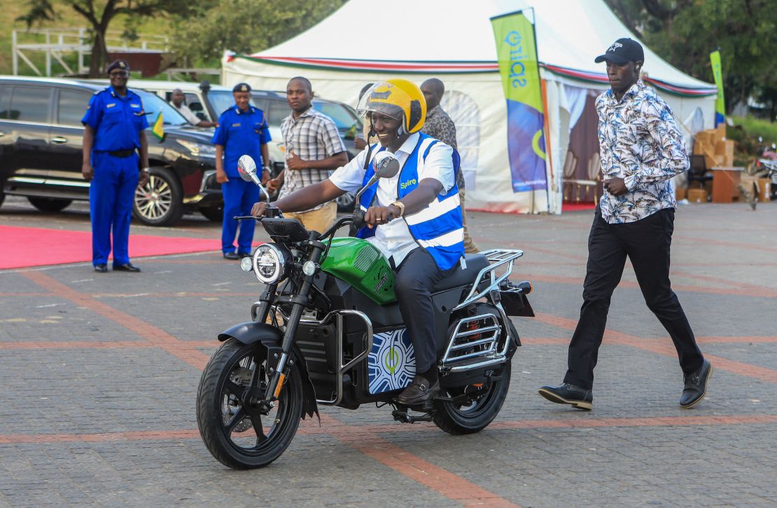 TOPSHOT - Kenya's President William Ruto uses an electric motorcycle during the national launch of an electric motorcycle project dubbed e-bodaboda at Kenyan Coastal city of Mombasa on September 1, 2023. The initiative launched by Kenya's President William Ruto is a collaboration between the Government of Kenya and Spiro, an electric two-wheeler company.This agreement, centred around the delivery of over a million (1.2 million) electric motorcycles and the establishment of more than 3,000 swapping stations in Kenya. (Photo by AFP) (Photo by -/AFP via Getty Images)