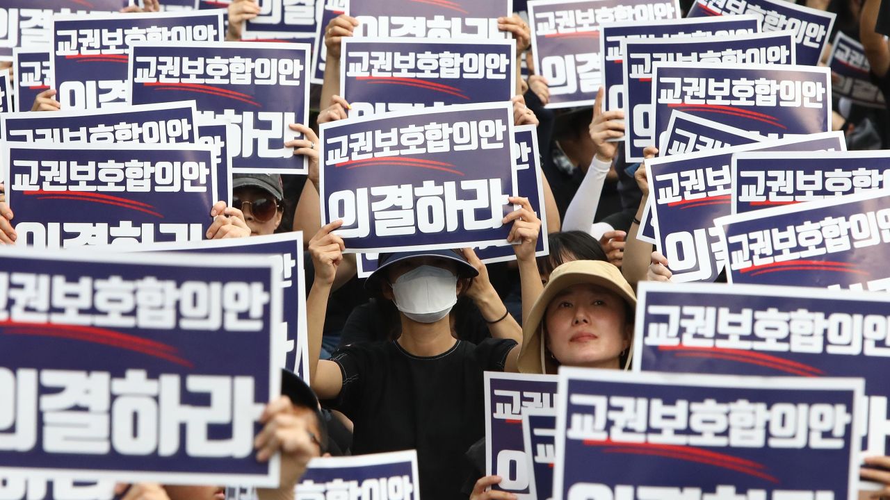 SEOUL, SOUTH KOREA - SEPTEMBER 04: South Korean teachers participate in a rally in front of National Assembly on September 04, 2023 in Seoul, South Korea. School teachers hold a massive rally in Seoul on Monday to mourn the recent suicide deaths of fellow teachers distressed by disgruntled parents and unruly students, and to call for measures to prevent such tragedies. (Photo by Chung Sung-Jun/Getty Images)