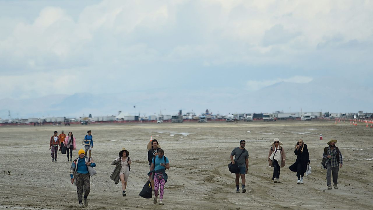 People leave a playa near the Burning Man site in the Black Rock Desert in northern Nevada on Sunday. 