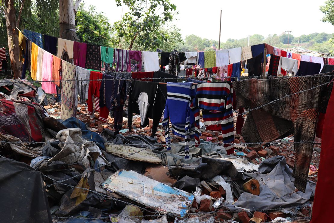 Clothes hanging to dry near demolished houses opposite Pragati Maidan. 