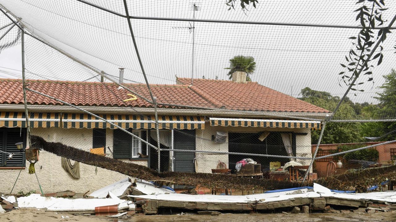 This photograph shows rubbles in front of a house in the town of Aldea del Fresno, in the Madrid region on September 4, 2023, as a man was reported missing after his vehicle was swept away by an overflowing river during heavy rains, according to Madrid's emergency services. Affected for months by a historic drought, Spain has been hit by torrential rain that left two people dead and one missing on September 4. This meteorological phenomenon, known as the "Dana" ("isolated high-level depression" in Spanish), began on September 3 afternoon and continued into the night, particularly in Madrid and Castilla-La-Mancha, where torrents of water poured down. (Photo by Oscar DEL POZO CAÑAS / AFP) (Photo by OSCAR DEL POZO CANAS/AFP via Getty Images)