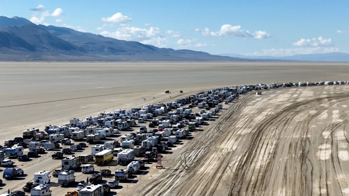 A caravan of vehicles lined up to leave the Burning Man festival near Black Rock City, Nevada, on September 4, 2023.