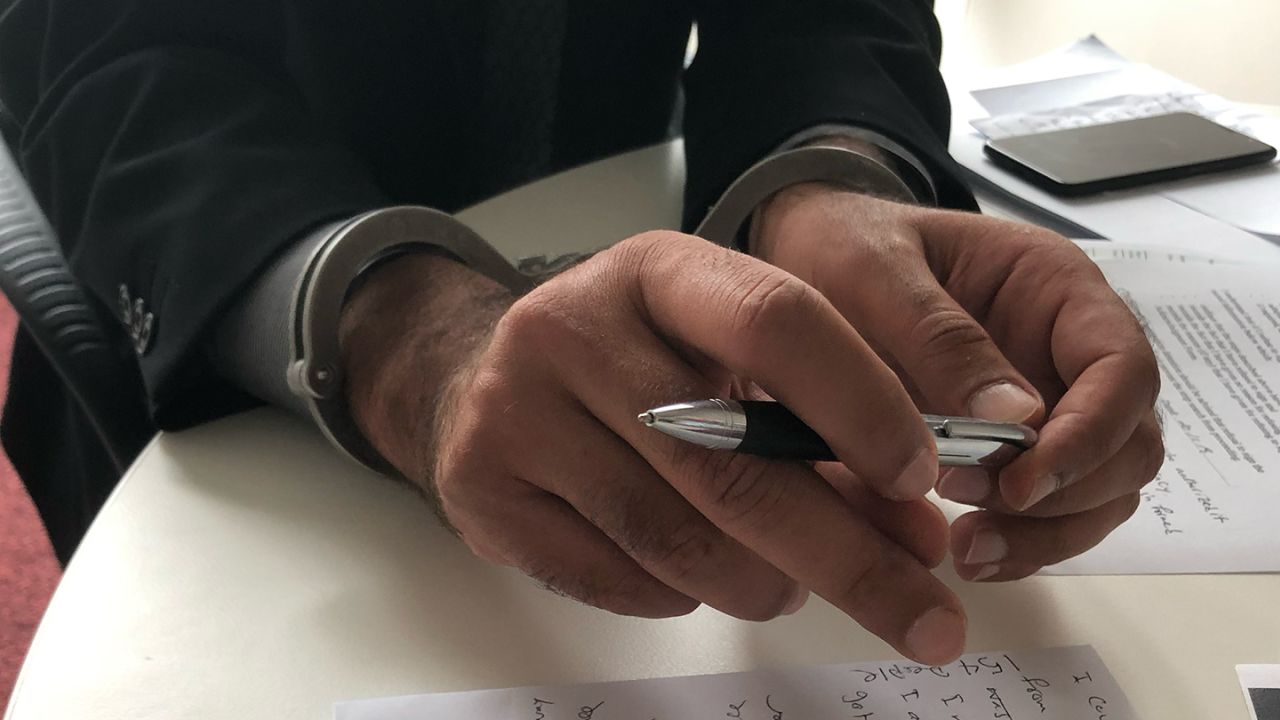 Iranian asylum seeker Ned Kelly Emeralds has been mute for almost a decade and writes or texts to communicate.