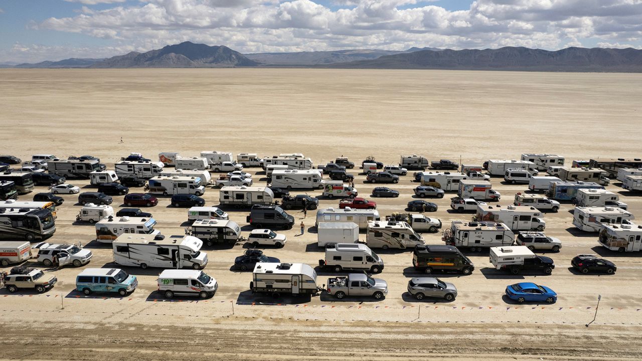 Thousands of people waited hours Monday to leave Burning Man in Nevada's Black Rock City. 