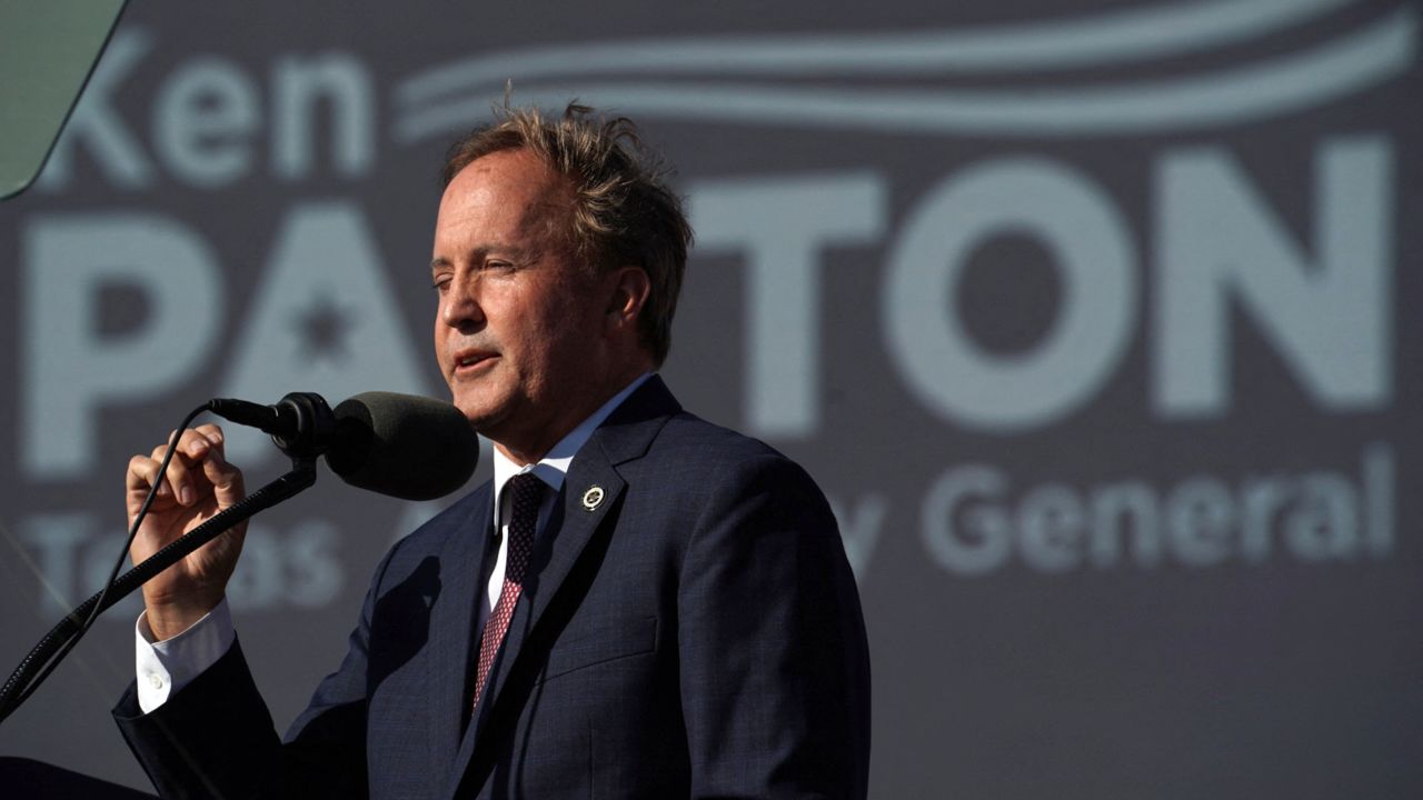 Texas Attorney General Ken Paxton speaks ahead of a rally held by former President Donald Trump, in Robstown, Texas, on October 22, 2022. 