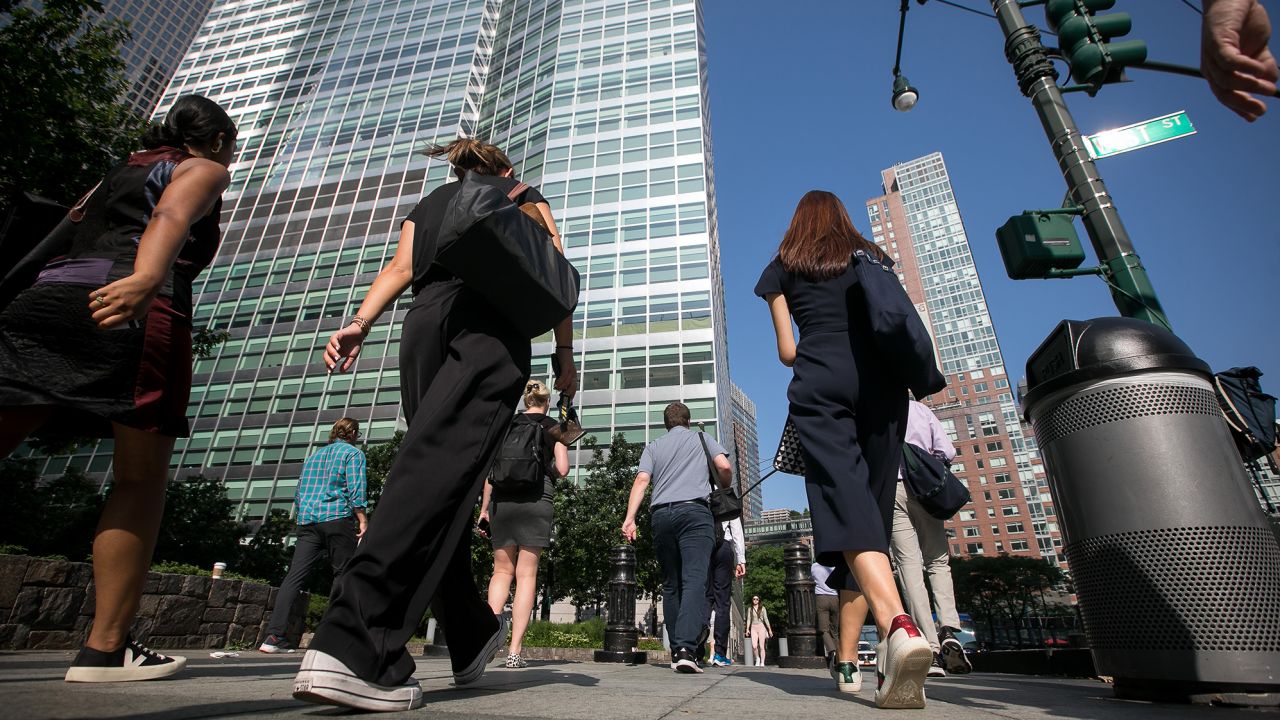Pedestrians walk towards Goldman Sachs headquarters in New York, US, on Thursday, July 6, 2023. 
