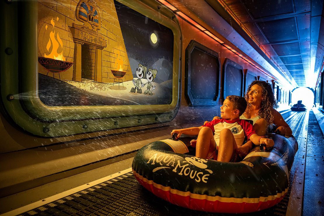 Onboard the Disney Treasure, AquaMouse: Curse of the Golden Egg, Disney Cruise Line's own attraction at sea, will introduce an all-new storyline to its existing lineup that follows Mickey Mouse and Minnie Mouse on a zany misadventure into an ancient temple. Suspended high above the upper decks, powerful jets will propel two-person ride vehicles through 760 feet of winding tubes, offering breathtaking views of the ocean and the ship below. (Disney)