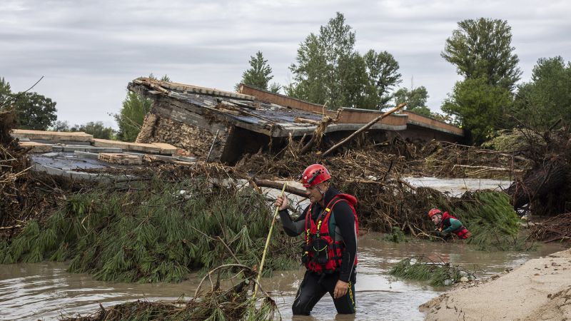 Spain floods: Boy rescued after spending all night clinging to a tree