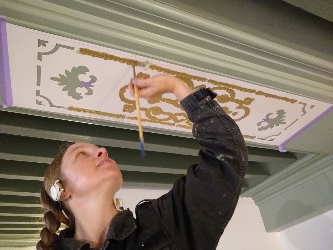 They rebuilt and hand painted an original wood Renaissance-era ceiling that had previously been covered.