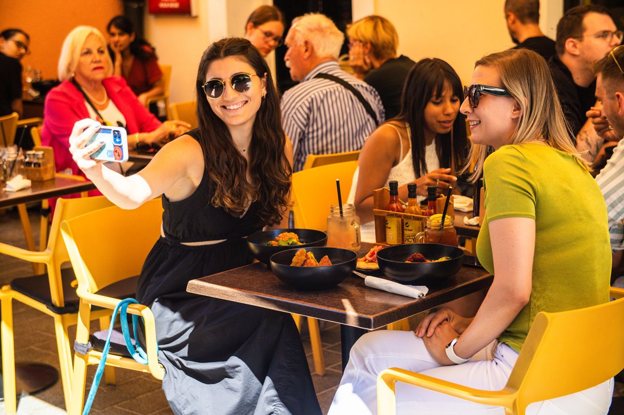 Diners try food at Curry Bowl in Zagreb, Croatia.