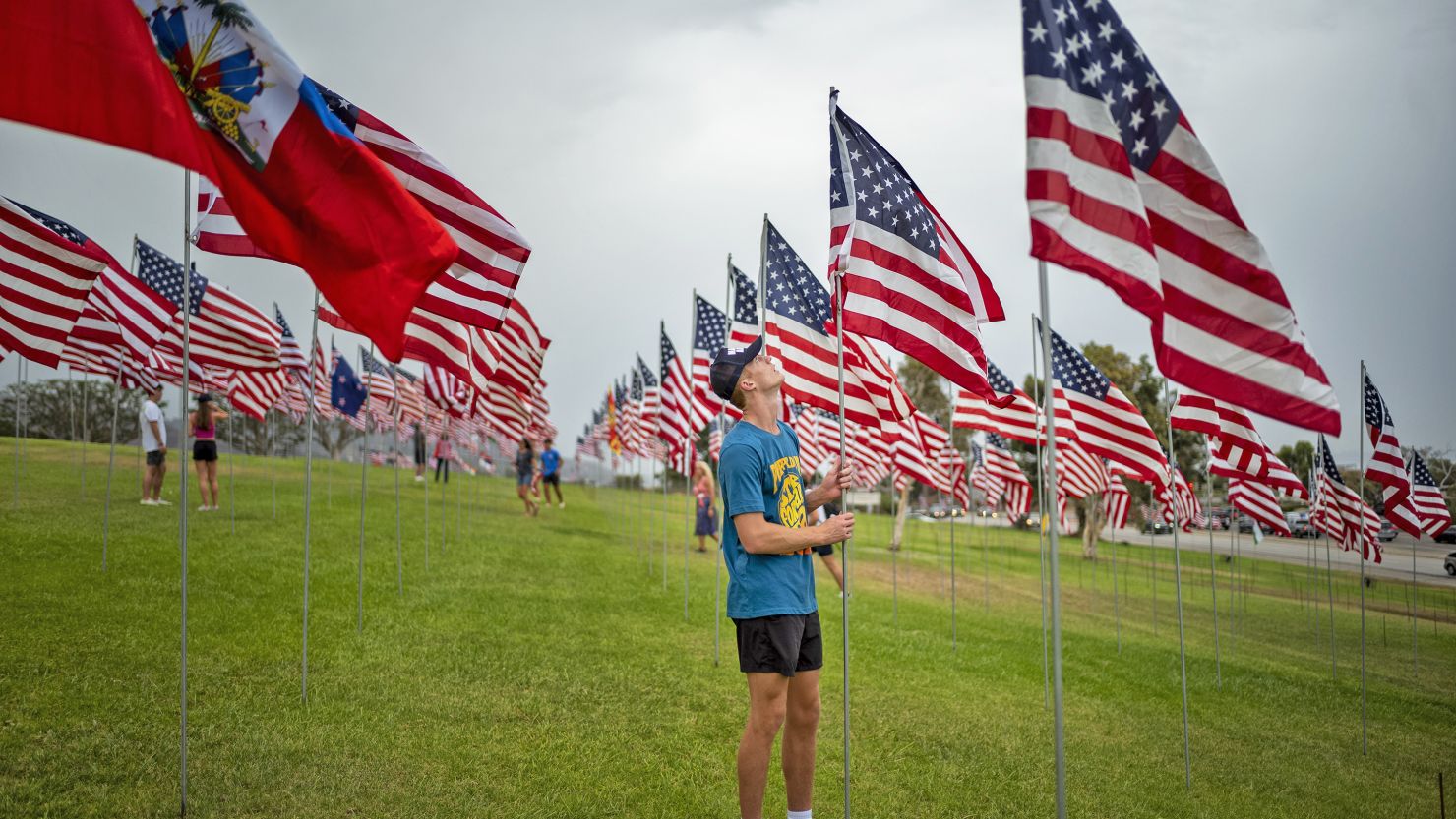 Volunteers place flags at a September 11 remembrance event in 2022.        