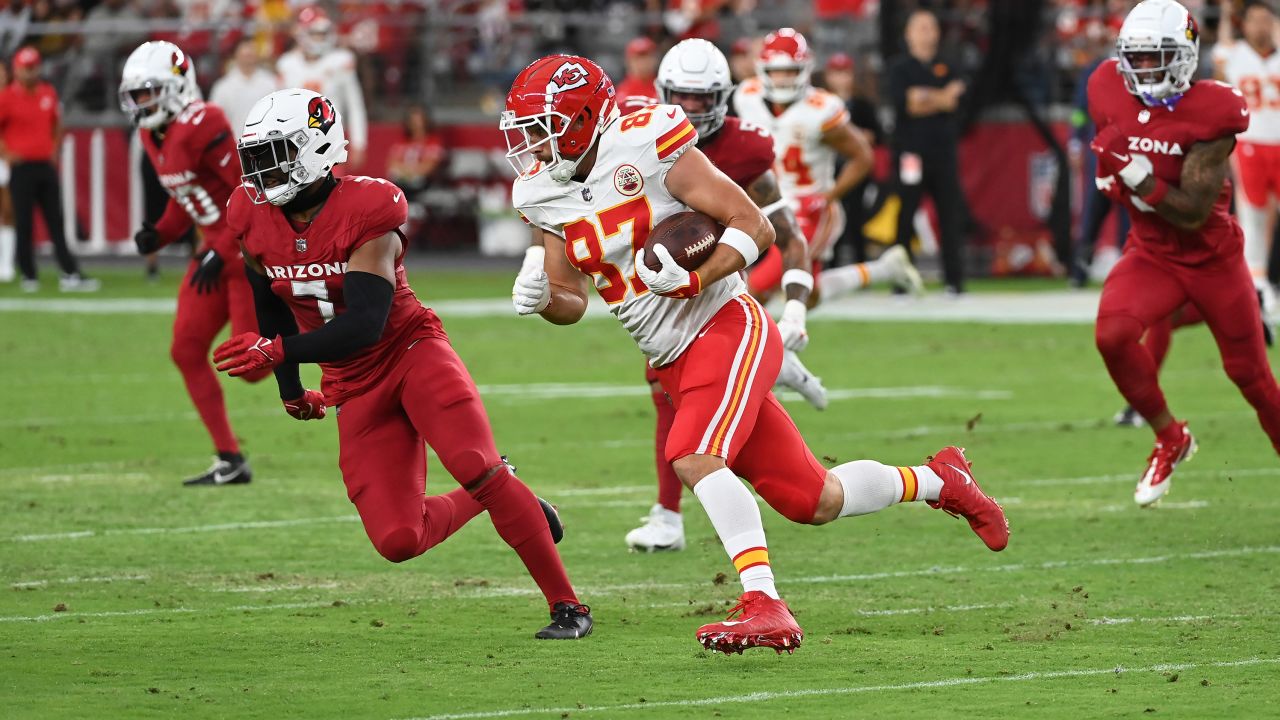 Travis Kelce #87 of the Kansas City Chiefs runs with the ball after catching a pass during the first quarter of a preseason game against the Arizona Cardinals at State Farm Stadium on August 19, 2023 in Glendale, Arizona.