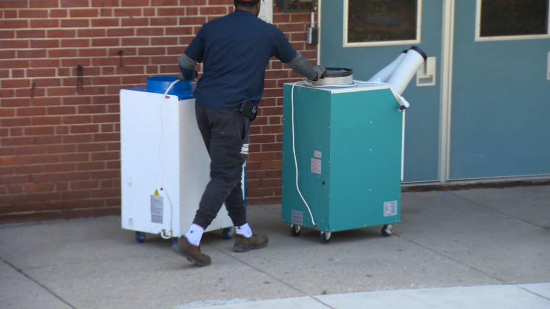 Cooling units are brought to a Baltimore school. 