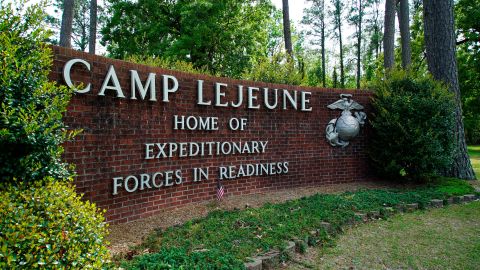 In this April 2022 photo, signage stands on the main gate to Camp Lejeune Marine Base outside Jacksonville, North Carolina.