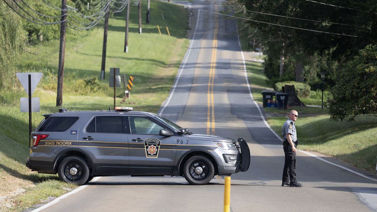 Pennsylvania State Police block Greenwood Road near Longwood Gardens as the search continues for Danelo Cavalcante.