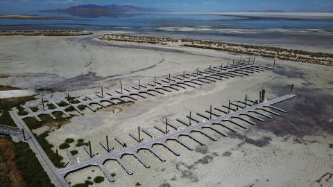 FILE - Empty docks are visible at the Antelope Island Marina due to record low water levels on Aug. 31, 2022, on the Great Salt Lake, near Syracuse, Utah. After years of sailboats being hoisted out of the shrinking Great Salt Lake amid fears they might not return, sailors are back this summer. (AP Photo/Rick Bowmer, File)