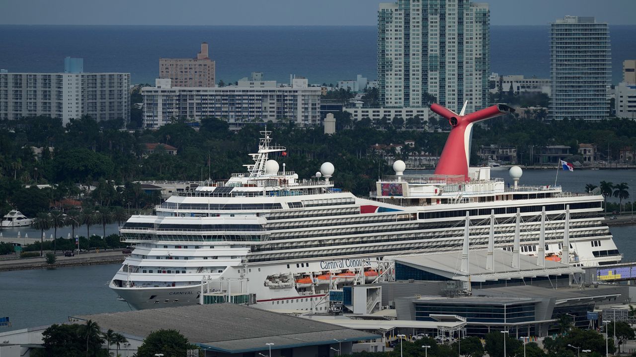 The Carnival Conquest cruise ship sits docked in Miami in October 2021.