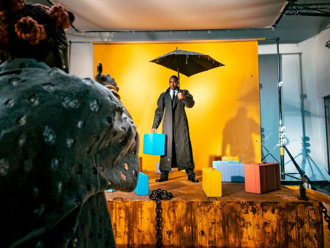 Idris Elba braves the weather and gets the thumbs up mid-shoot. The actor has Ghanaian ancestry on his mother's side.