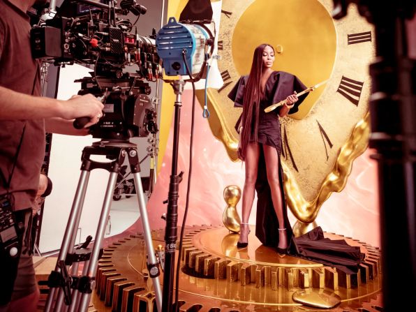 Supermodel Naomi Campbell holds time in her hand in a backstage image from the 2024 Pirelli calendar photoshoot. The 50th edition of the prestigious calendar is photographed by Ghanaian Prince Gyasi, the first Black photographer to receive the commission. <strong><em>Scroll through the gallery to see which celebrity names feature this year.</em></strong>