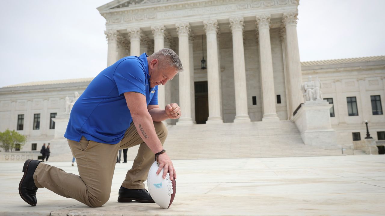 Joe Kennedy takes a knee in front of the US Supreme Court in 2022.