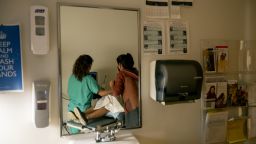 ALBUQUERQUE, NM - JUNE 23, 2022: A family physician and her resident perform an ultrasound on a 39-year-old woman who already has four children the day before the Supreme Court overturned Roe v. Wade at the Center for Reproductive Health clinic on June 23, 2022 in Albuquerque, New Mexico. She later had a surgical abortion at the clinic. New Mexico  will see an influx of patients from neighboring states which have banned abortion. The doctor does not want to be identified for security reasons.(Gina Ferazzi / Los Angeles Times via Getty Images)