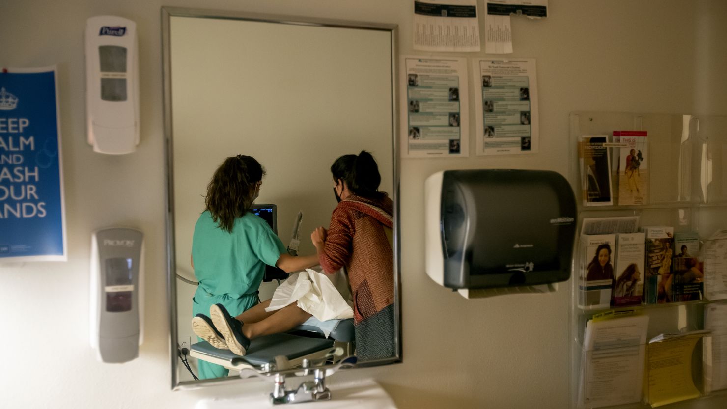 ALBUQUERQUE, NM - JUNE 23, 2022: A family physician and her resident perform an ultrasound on a 39-year-old woman who already has four children the day before the Supreme Court overturned Roe v. Wade at the Center for Reproductive Health clinic on June 23, 2022 in Albuquerque, New Mexico. She later had a surgical abortion at the clinic. New Mexico  will see an influx of patients from neighboring states which have banned abortion. The doctor does not want to be identified for security reasons.(Gina Ferazzi / Los Angeles Times via Getty Images)