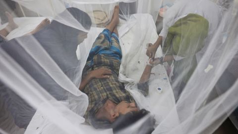 A dengue-infected patient stays under mosquito nets as he receives treatment in the Shaheed Suhrawardy Medical College and Hospital in Dhaka, Bangladesh, July 26, 2023. REUTERS/Mohammad Ponir Hossain