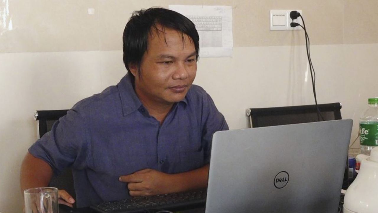 Sai Zaw Thaike, a photojournalist for the independent news website Myanmar Now, works at his desk in Yangon, Myanmar in August 2020. 