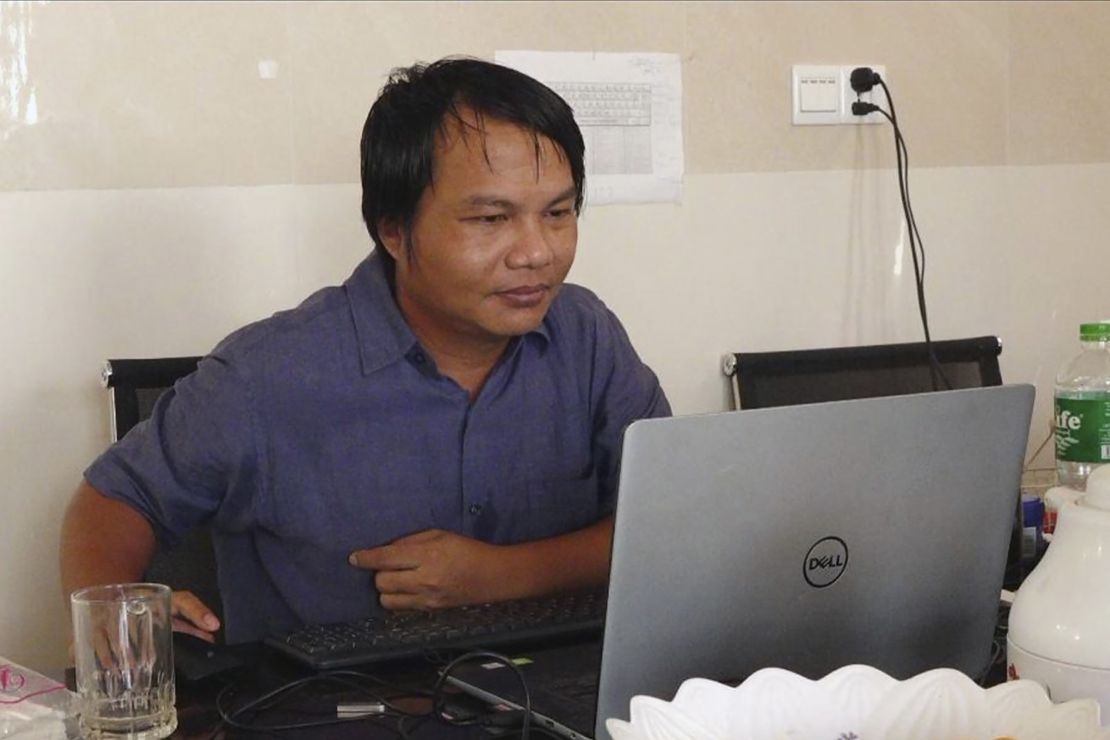 Sai Zaw Thaike, a photojournalist for the independent news website Myanmar Now, works at his desk in Yangon, Myanmar in August 2020. 