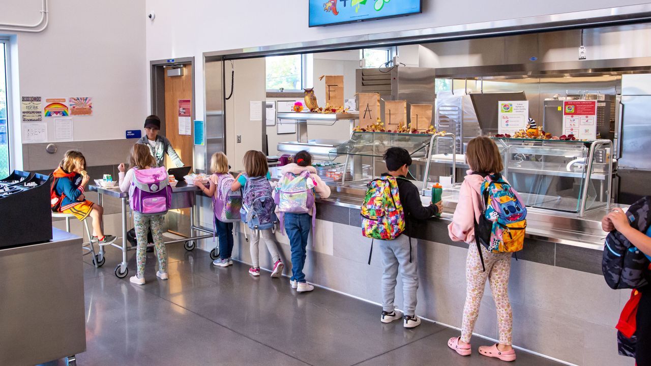 Students at Gudy Gaskill Elementary School in Centennial, Colorado, pick up their lunch.