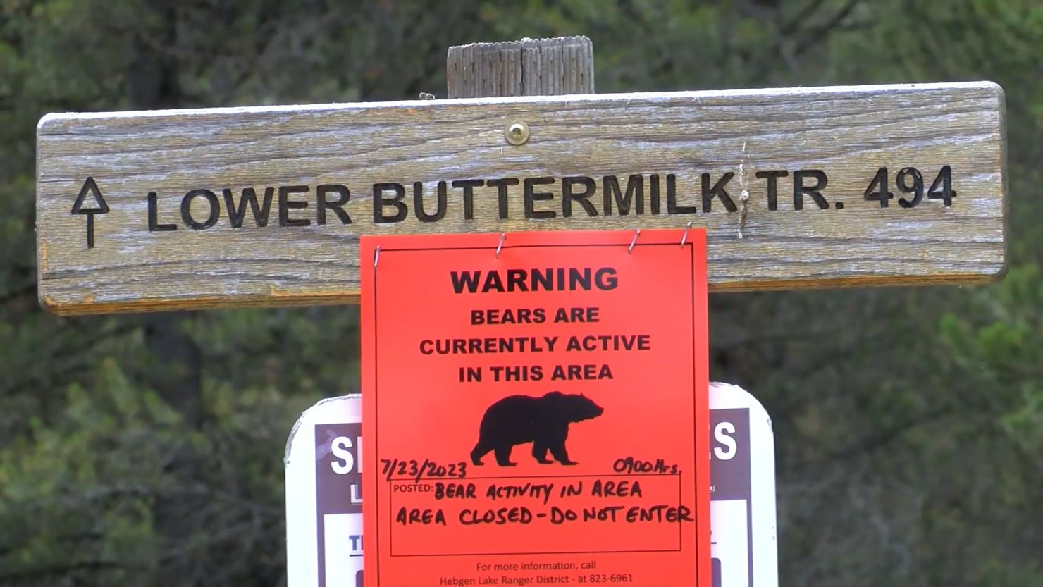 A sign warns of bear activity after a bear fatally attacked a woman in West Yellowstone, Montana, in July. 