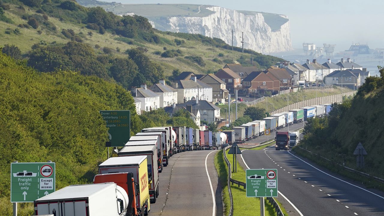Trucks queue for the Port of Dover along the A20 in Kent, in southeast England, on Thursday, amid increased security checks.