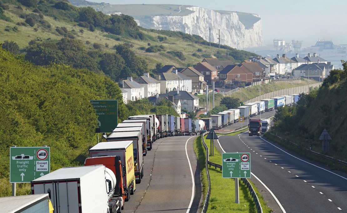Trucks queue for the Port of Dover along the A20 in Kent, in southeast England, on Thursday, amid increased security checks.