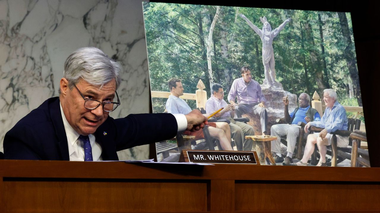 Senate Judiciary Committee member Sen. Sheldon Whitehouse displays a copy of a painting featuring Supreme Court Associate Justice Clarence Thomas alongside other conservative leaders during a hearing on Supreme Court ethics reform in the Hart Senate Office Building on Capitol Hill on May 02, 2023 in Washington, DC. The painting was commissioned by billionaire Texas Republican real estate developer Harlan Crow, who, according to a recent ProPublica investigation, invited Thomas on many luxury vacations over a number of years.