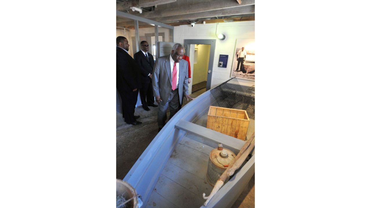 Supreme Court Justice Clarence Thomas looks at the displays inside the Pin Point Heritage Museum. Thomas was born in Pin Point, Georgia, a small, predominantly Black community near Savannah.