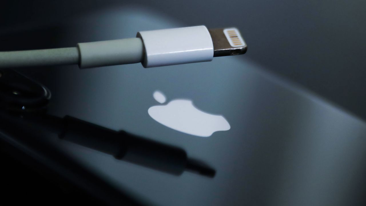 Lightning cable and Apple logo on iPhone are seen in this illustration photo taken in Krakow, Poland on September 25, 2021. (Photo by Jakub Porzycki/NurPhoto via Getty Images)