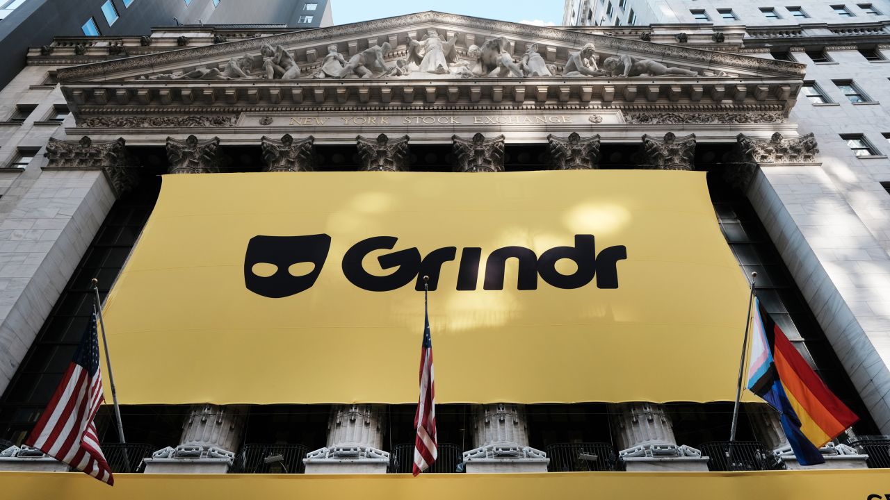 NEW YORK, NEW YORK - NOVEMBER 18: The LGBTQ social networking platform Grindr displays its banner outside of the New York Stock Exchange (NYSE) as the company goes public following its merger with special purpose acquisition company (SPAC) Tiga Acquisition Corp. on November 18, 2022 in New York City. Trading under the ticker symbol "GRND," the stock surged in morning trading.  (Photo by Spencer Platt/Getty Images)