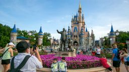 FILE - People visit the Magic Kingdom Park at Walt Disney World Resort in Lake Buena Vista, Fla., April 18, 2022. The first meeting of the new board of Walt Disney World's government — overhauled by sweeping legislation signed by Republican Gov. Ron DeSantis as an apparent punishment for Disney publicly challenging Florida's so-called "Don't Say Gay" bill — dealt with the rote affairs any other municipal government handles. Board members on Wednesday, March 8, 2023, faced calls for better firefighter equipment, lessons on public records requests and bond ratings. (AP Photo/Ted Shaffrey, File)