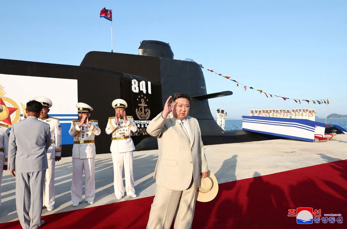 North Korean leader Kim Jong Un attends what state media report was a launching ceremony for a new tactical nuclear attack submarine.