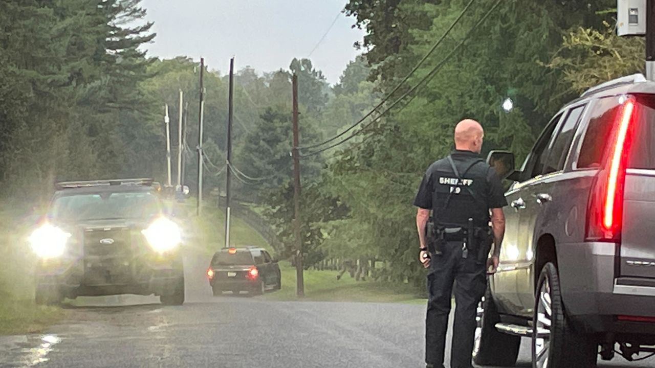 Police search an area of interest on the property of Longwood Gardens on Thursday.
