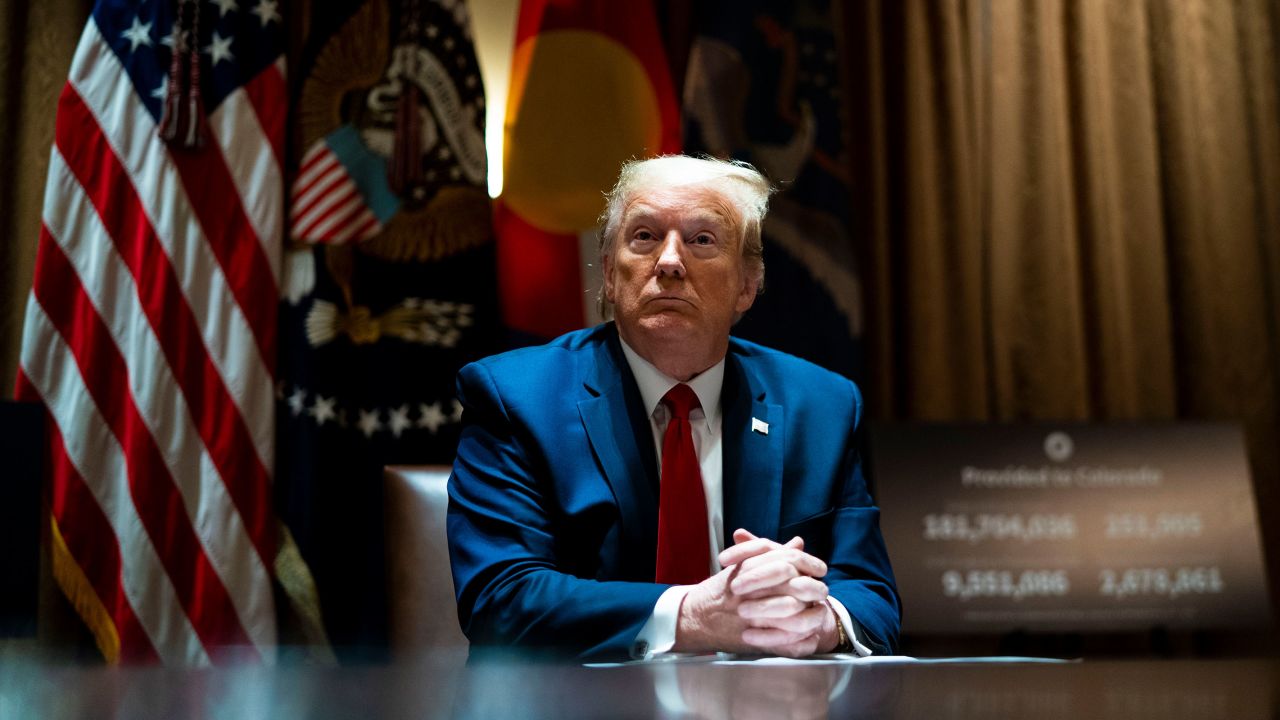 In this May 2020 photo, President Donald Trump looks on he as meets with Colorado Governor Jared Polis and North Dakota Governor Doug Burgum in the Cabinet Room of the White House in Washington, DC.