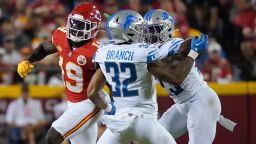 Detroit Lions safety Brian Branch (32) intercepts a pass intended for Kansas City Chiefs wide receiver Kadarius Toney (19) before running it back for a touchdown during the second half of an NFL football game Thursday, September 7, 2023, in Kansas City, Mo. 
