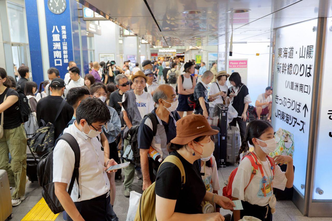 TOKYO, JAPAN - AUGUST 16: Tourists wait as the bullet train service has been suspended after Typhoon Lan triggers torrential rain in Shizuoka at Tokyo Station on August 16, 2023 in Tokyo, Japan. Over 70 people were injured as the typhoon hit across western Japan after making a landfall in Kushimoto, Wakayama. Torrential rain triggered by the typhoon in Shizuoka suspends the service of bullet train. (Photo by The Asahi Shimbun via Getty Images)