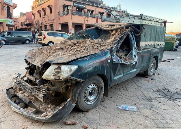 A damaged vehicle sits in a street in Marrakech on September 9.